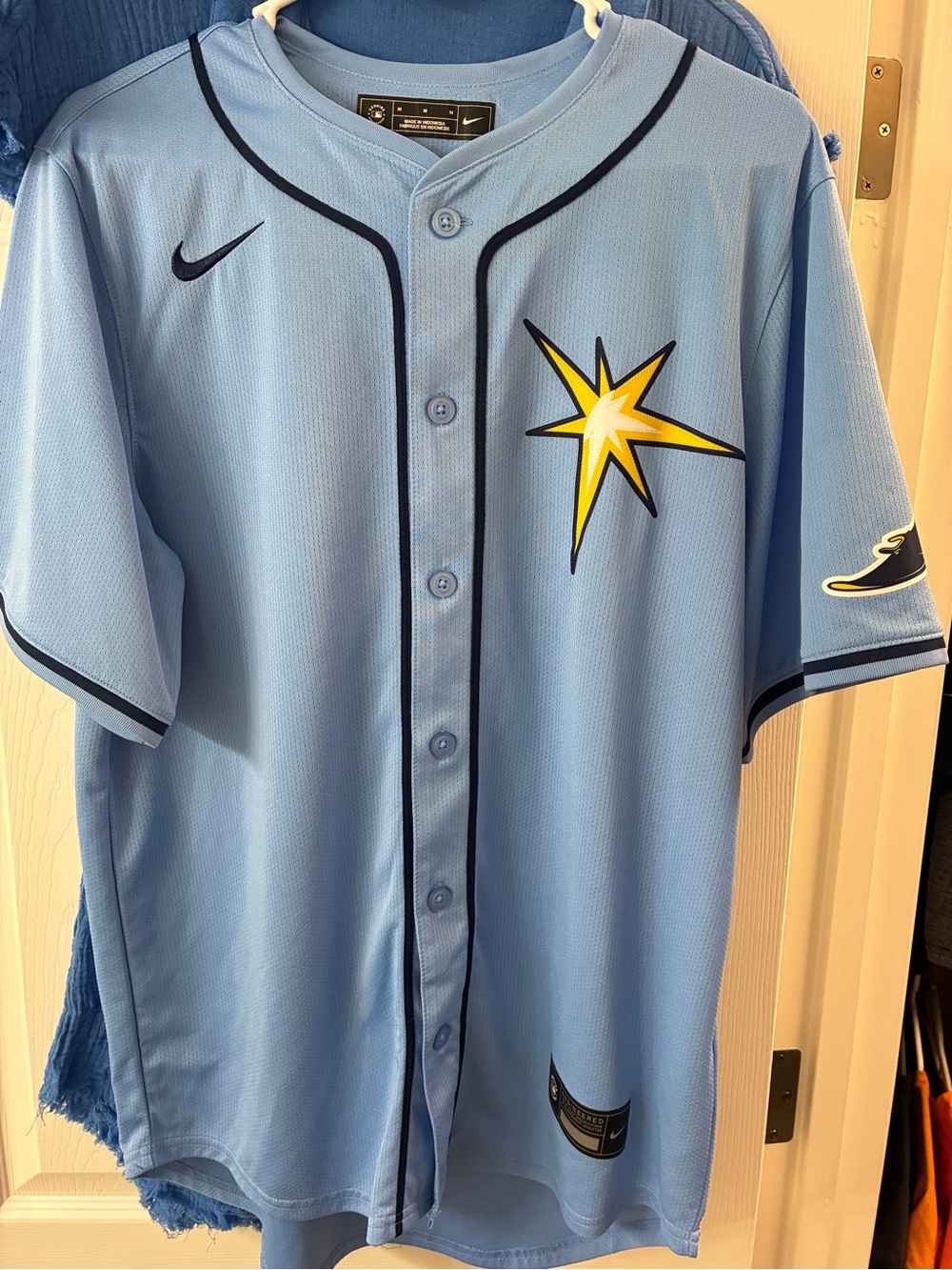 Nike Light Blue Baseball Jersey with Yellow Star Accent